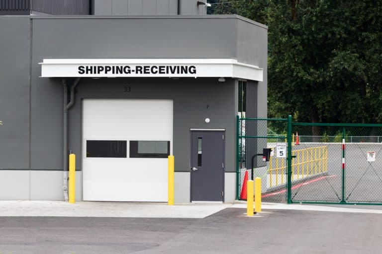 Gated shipping and receiving entrance at an industrial facility, the kind of vehicle access point an industrial RFID reader controls.